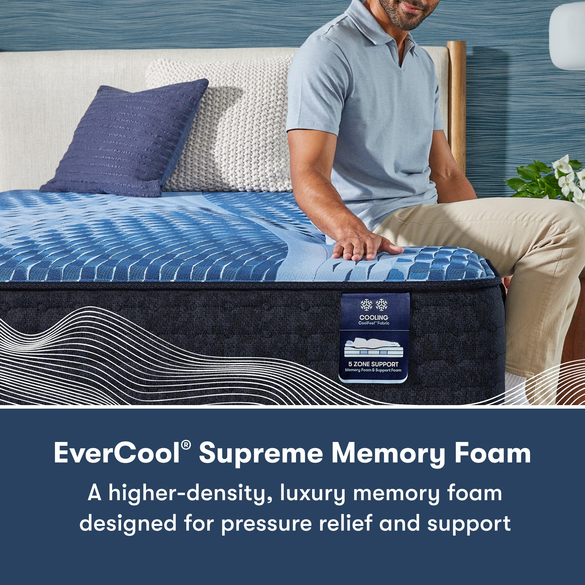 Man sitting on the right side of a Serta iComfort mattress || feel: medium || level: Enhanced - 14"